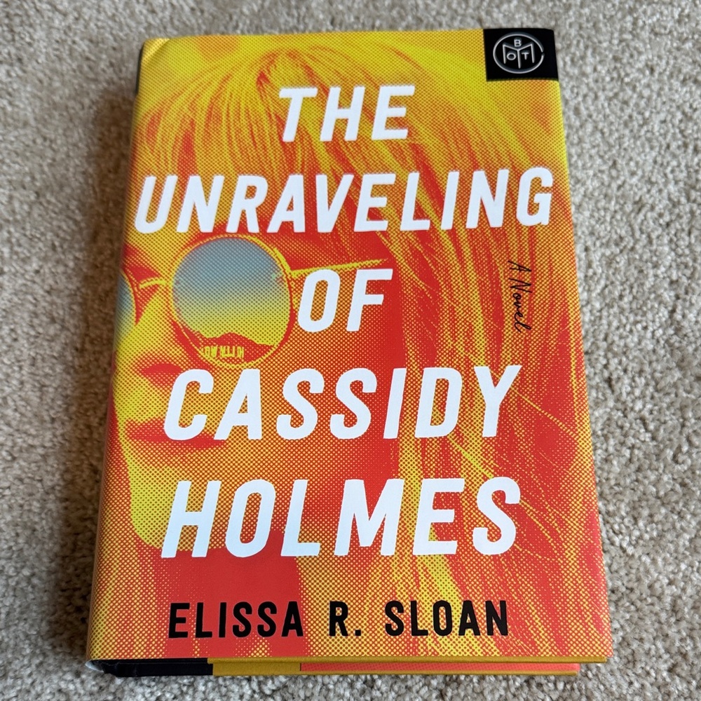 The Unraveling of Cassidy Holmes by Elissa R. Sloan - Bright Yellow/Orange Cover